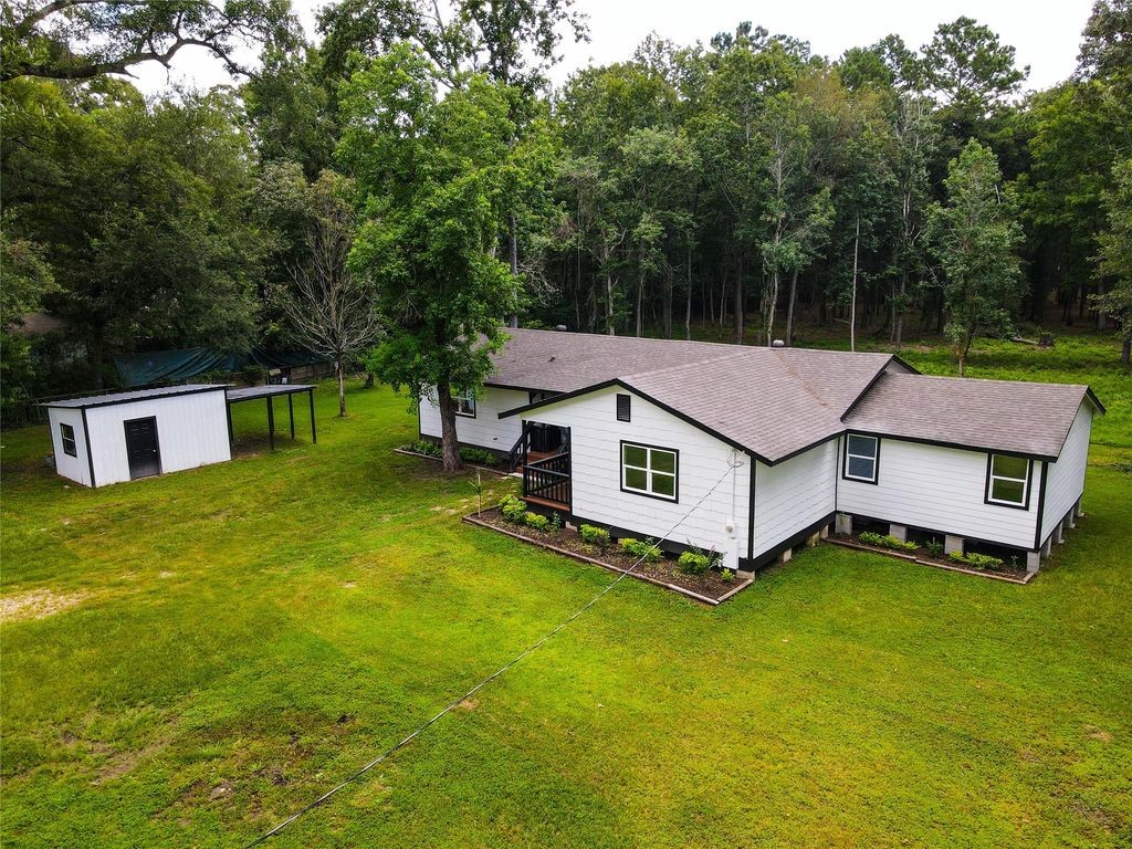 7728 White Rock Road Cleveland, TX 77328 - Photo 4 of 36 a aerial view of a house with swimming pool