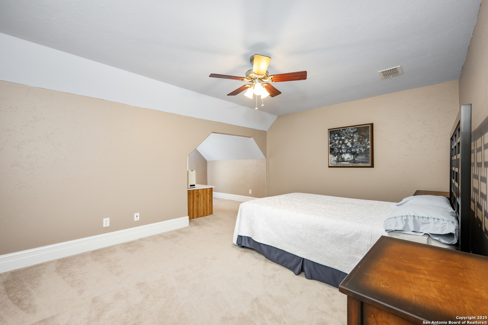 613 Saxet Trail Spring Branch, TX 78070 - Photo 26 of 41 a bedroom with a bed and a lamp on dresser