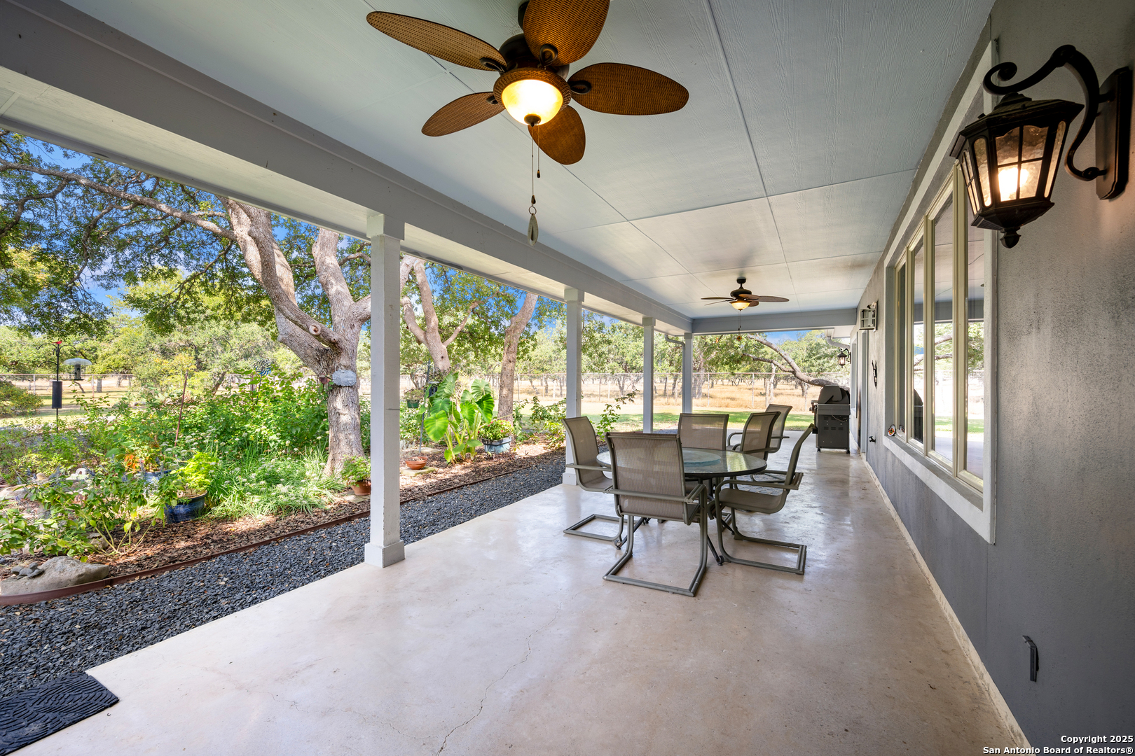 613 Saxet Trail Spring Branch, TX 78070 - Photo 31 of 41 a view of a dining room with furniture window and outside view