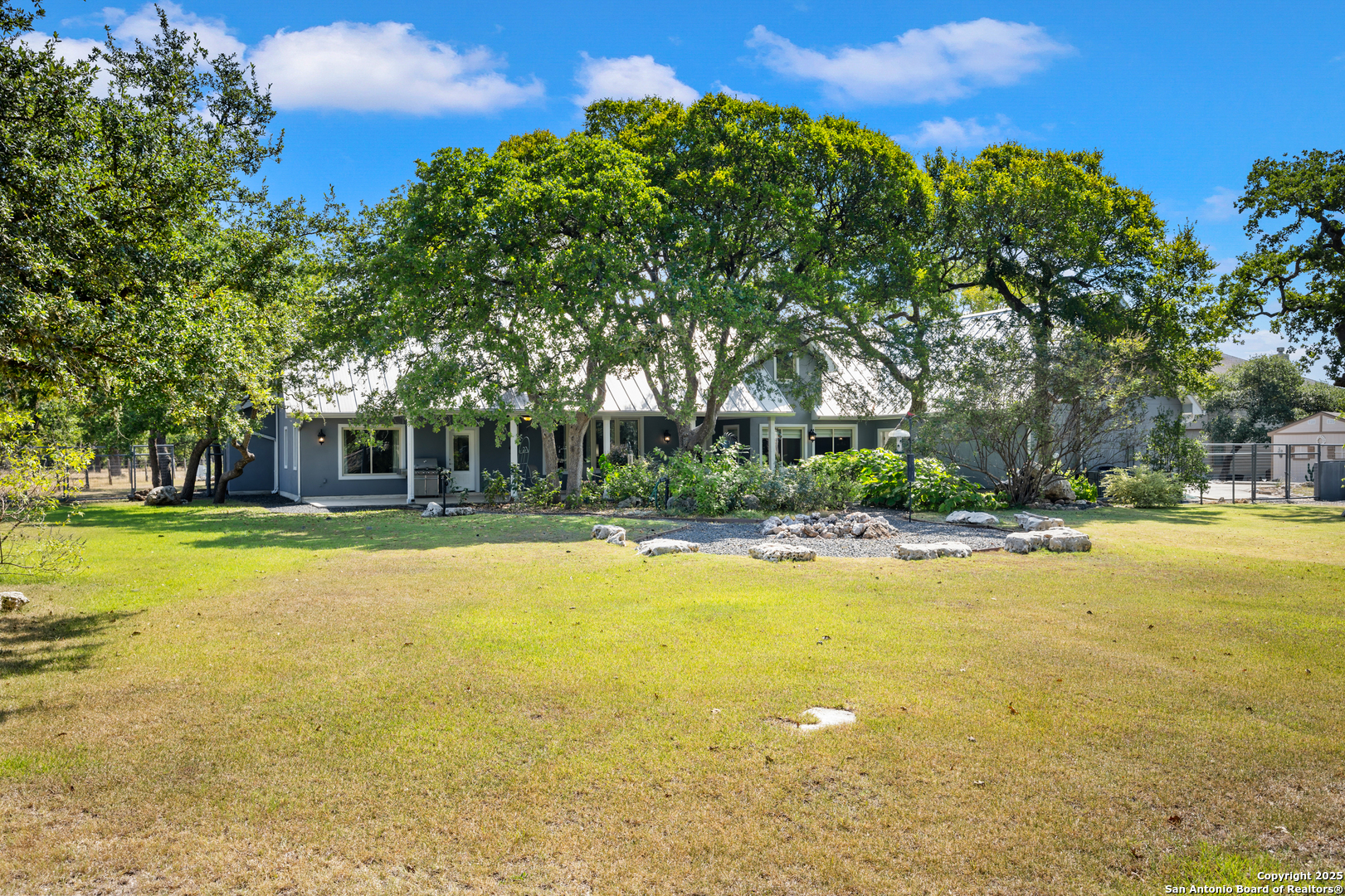 613 Saxet Trail Spring Branch, TX 78070 - Photo 32 of 41 a view of a swimming pool with an outdoor space and seating area