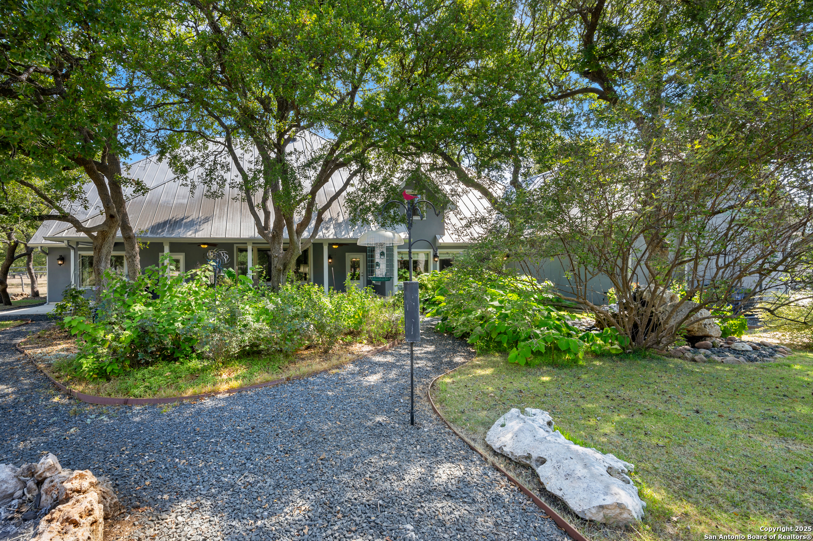 613 Saxet Trail Spring Branch, TX 78070 - Photo 37 of 41 a front view of a house with garden