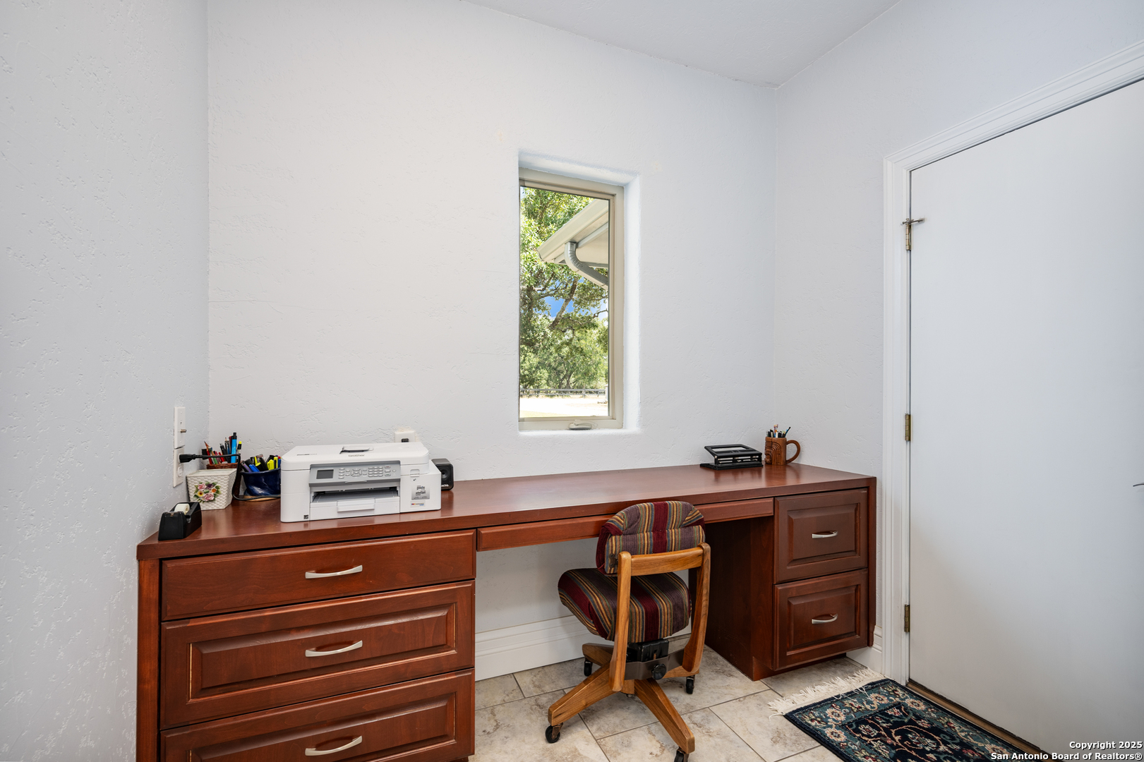 613 Saxet Trail Spring Branch, TX 78070 - Photo 40 of 41 a room with a window and a table