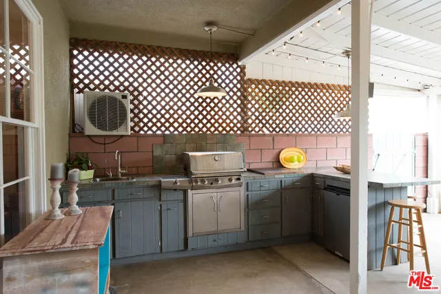 a kitchen with a stove and cabinets