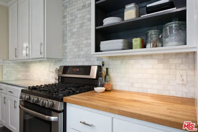 a kitchen with a stove and a microwave
