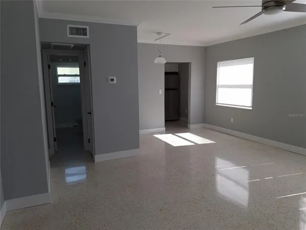 a view of an empty room with a bathroom