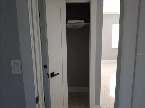 a view of an empty room with a window