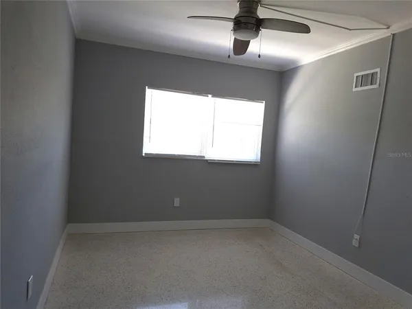 a view of an empty room and closet area