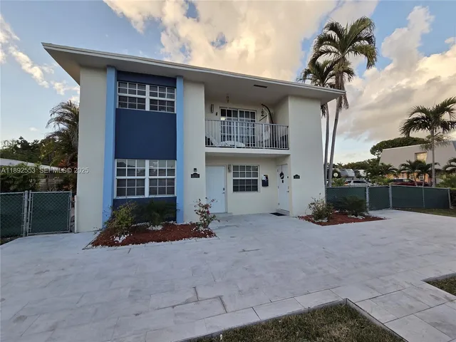a view of a kitchen with an empty space and a window