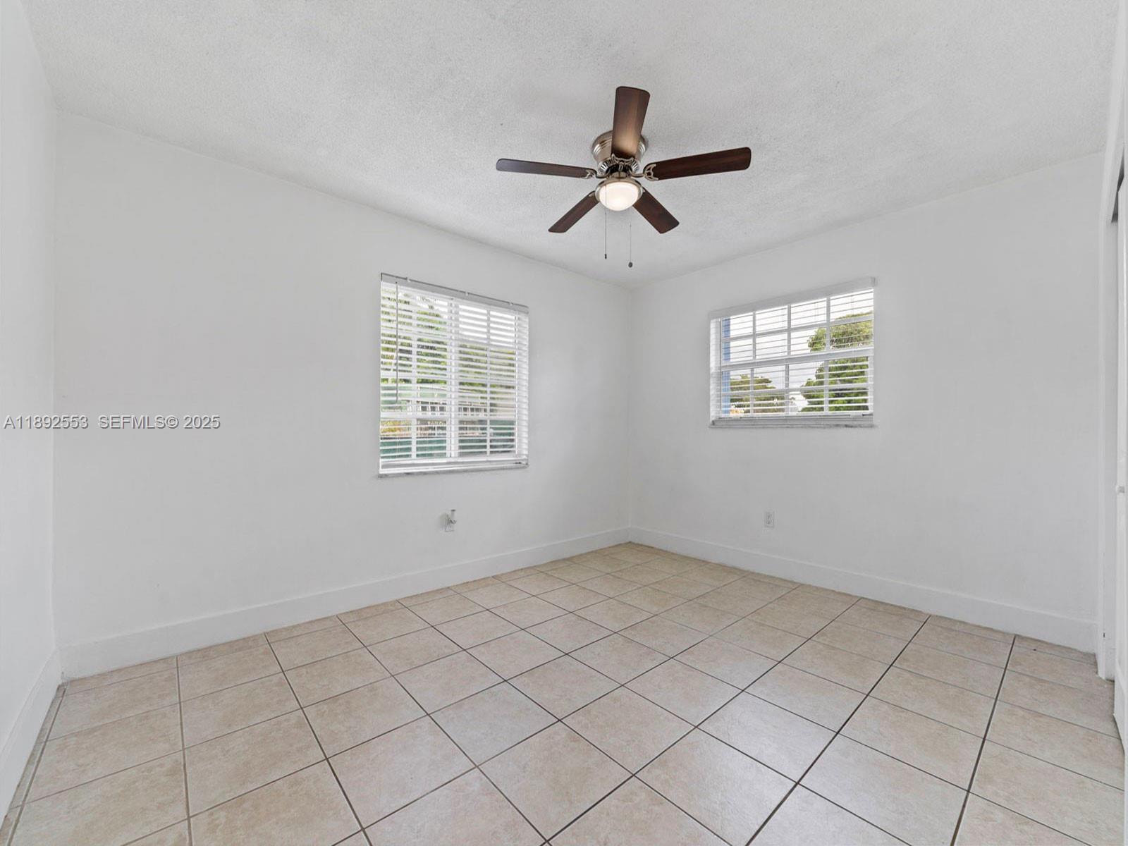 9100 Southwest 95th Avenue, Unit 9100 Miami, FL 33176 - Photo 22 of 37 a view of an empty room with a window