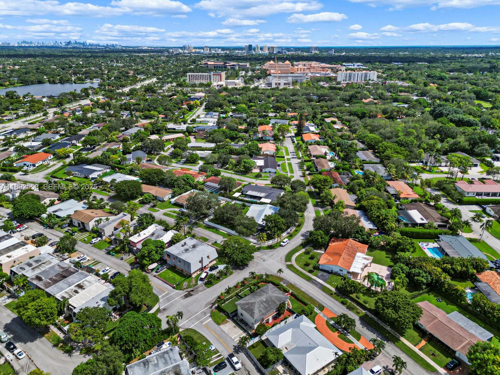 9100 Southwest 95th Avenue, Unit 9100 Miami, FL 33176 - Photo 31 of 37 an aerial view of residential houses with outdoor space and trees