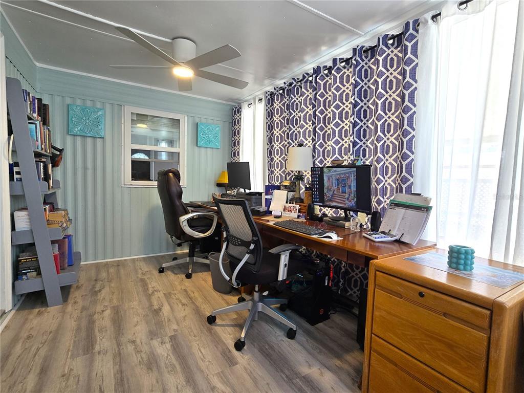 5619 Bayshore Road, Unit 435 Palmetto, FL 34221 - Photo 6 of 56 a view of a workspace with furniture and a window