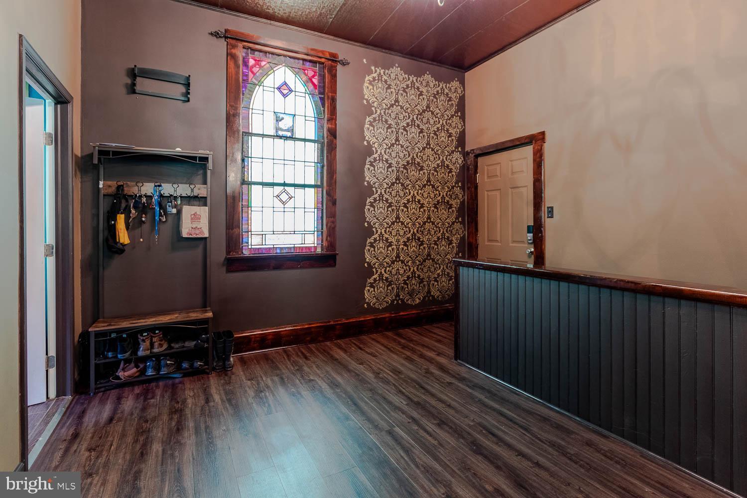 1070 Valley View Road Bellefonte, PA 16823 - Photo 2 of 52 a view of an empty room with wooden floor and a window