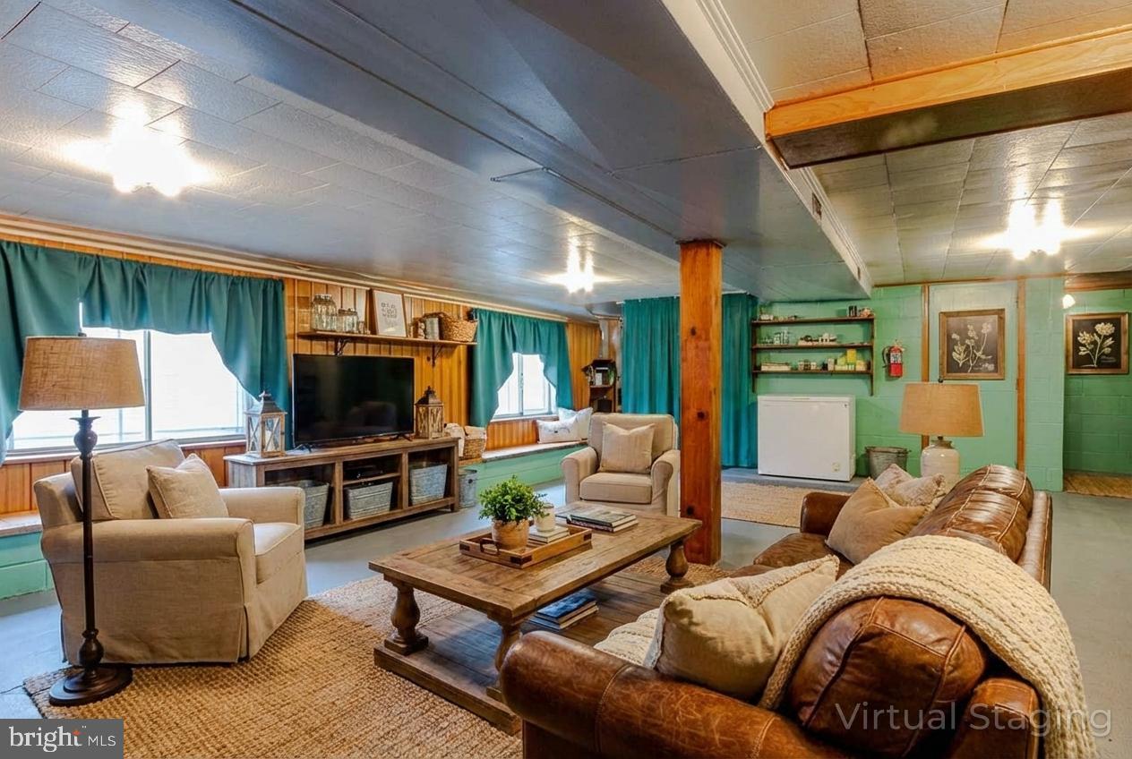 1070 Valley View Road Bellefonte, PA 16823 - Photo 28 of 52 a living room with furniture and a flat screen tv