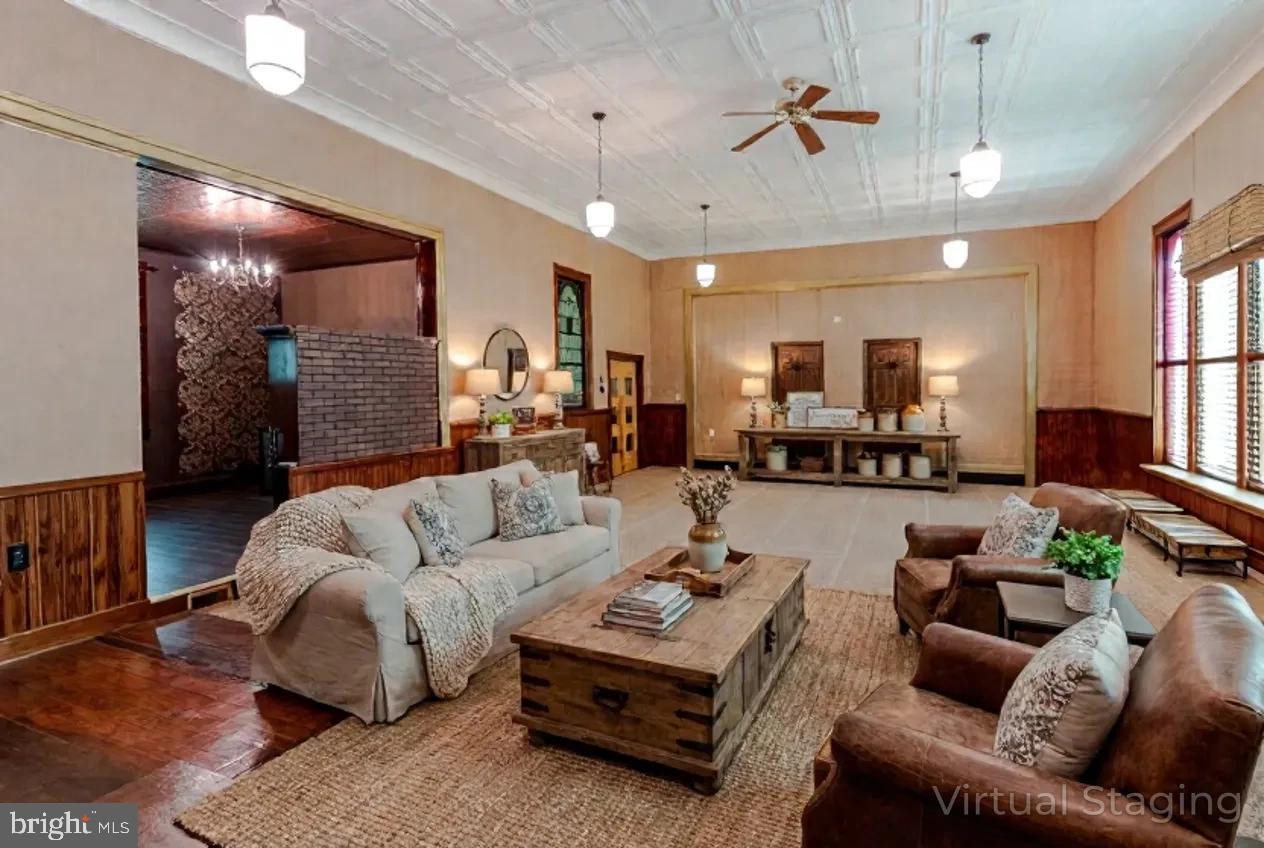 1070 Valley View Road Bellefonte, PA 16823 - Photo 4 of 52 a living room with furniture a ceiling fan and a rug