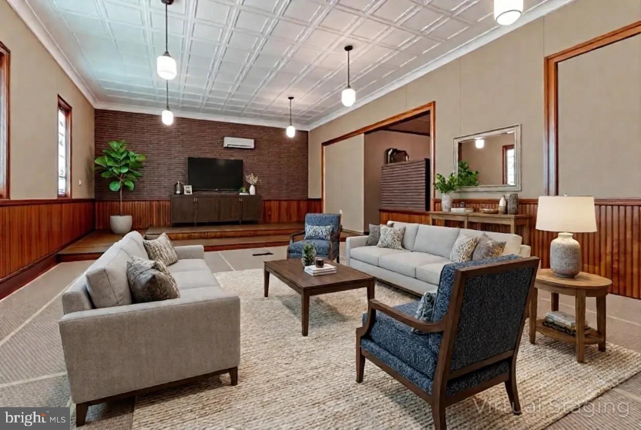 1070 Valley View Road Bellefonte, PA 16823 - Photo 6 of 52 a living room with furniture and a chandelier