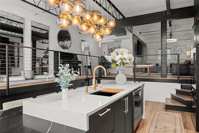 a table with chairs and flower vase with painted walls