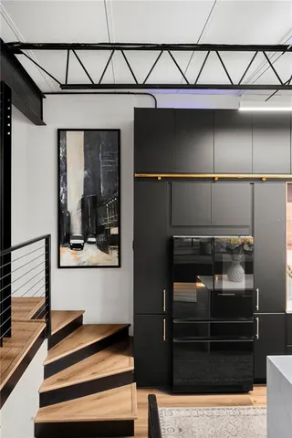 a living room with furniture and a lamp