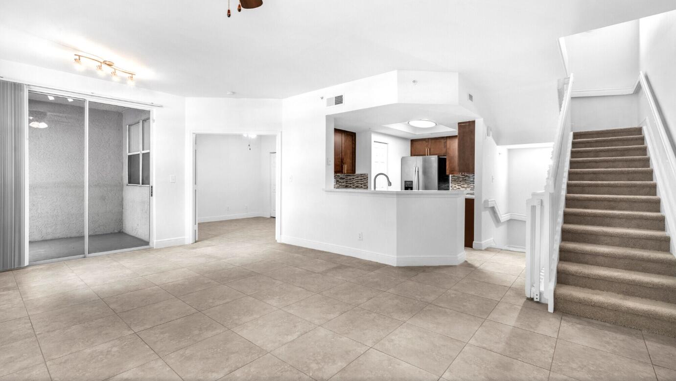 20889 St Andrews Boulevard Boca Raton, FL 33433 - Photo 5 of 5 a view of a kitchen with furniture and an empty room