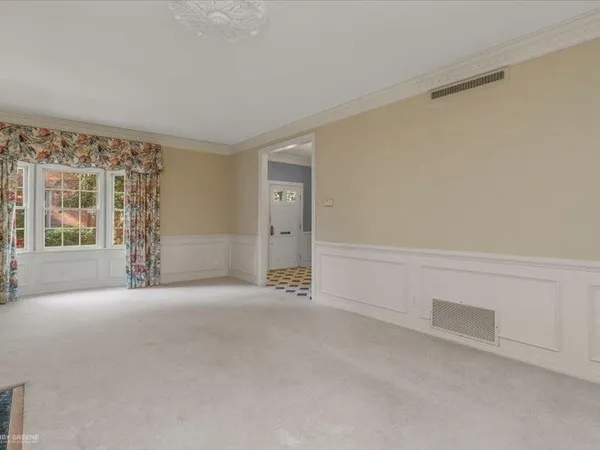 a view of an empty room with a window