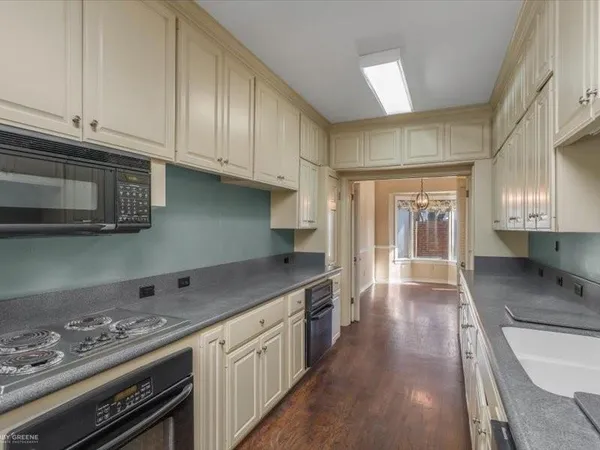 a kitchen with stainless steel appliances granite countertop a stove and a sink
