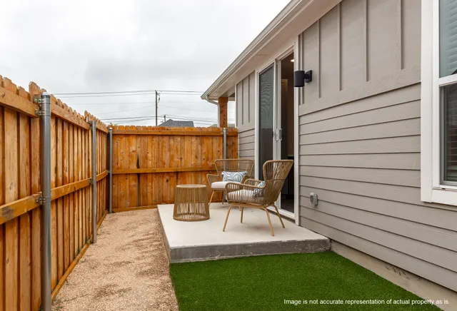 a patio with table and chairs