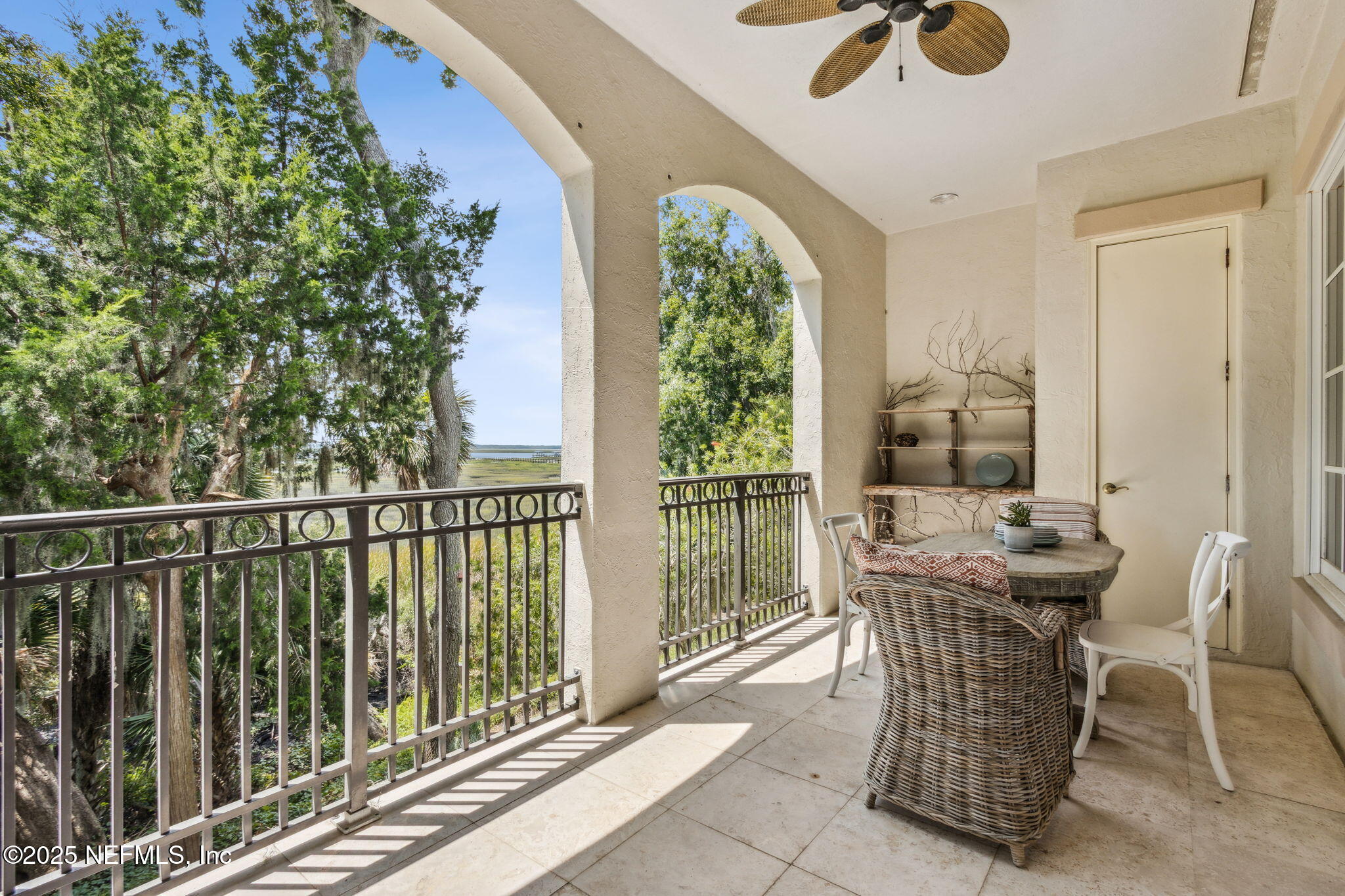 95032 Spring Tide Lane Fernandina Beach, FL 32034 - Photo 11 of 50 a view of a balcony dining table and chairs