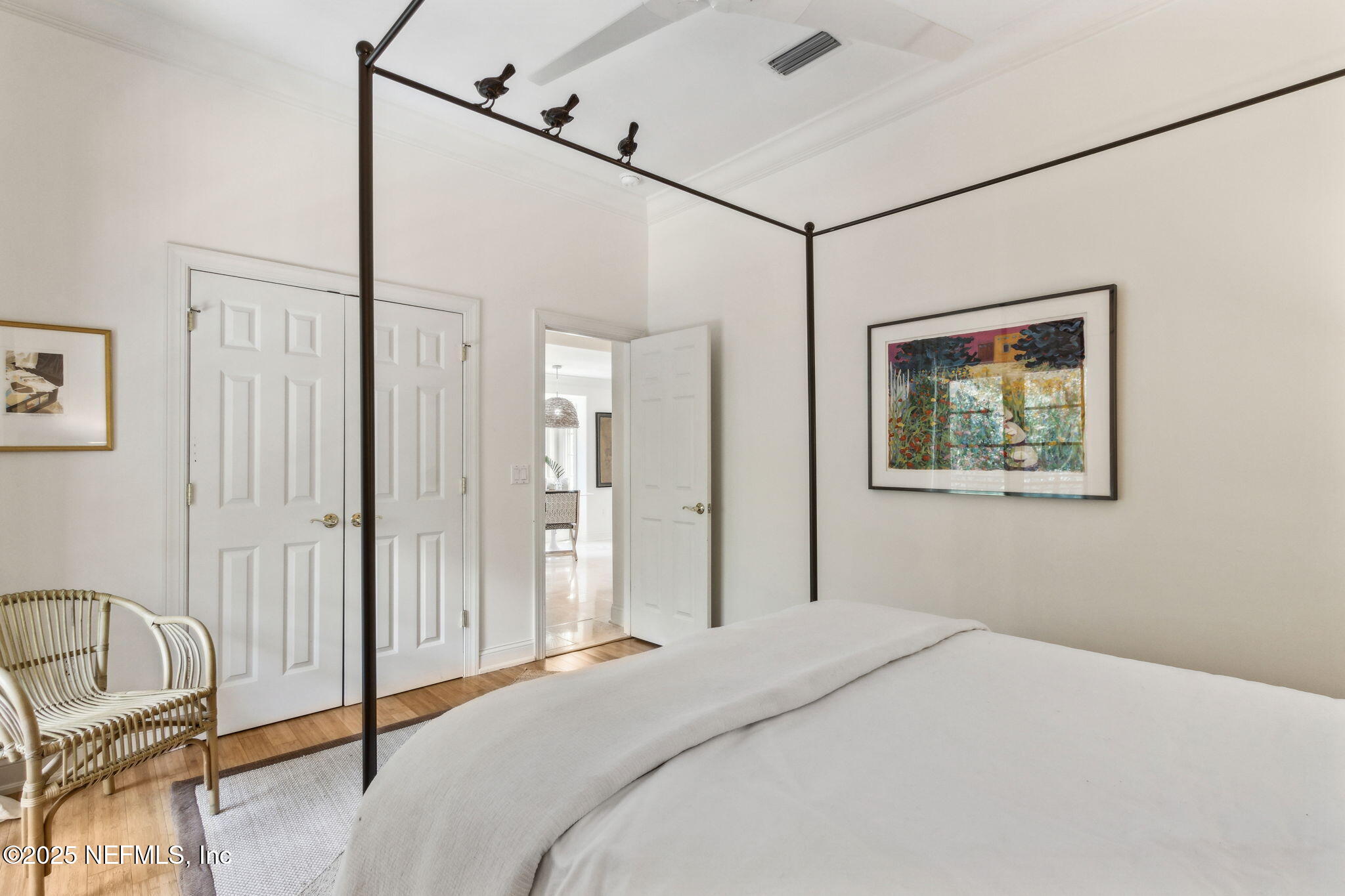 95032 Spring Tide Lane Fernandina Beach, FL 32034 - Photo 22 of 50 a bedroom with a bed and a painting on the wall