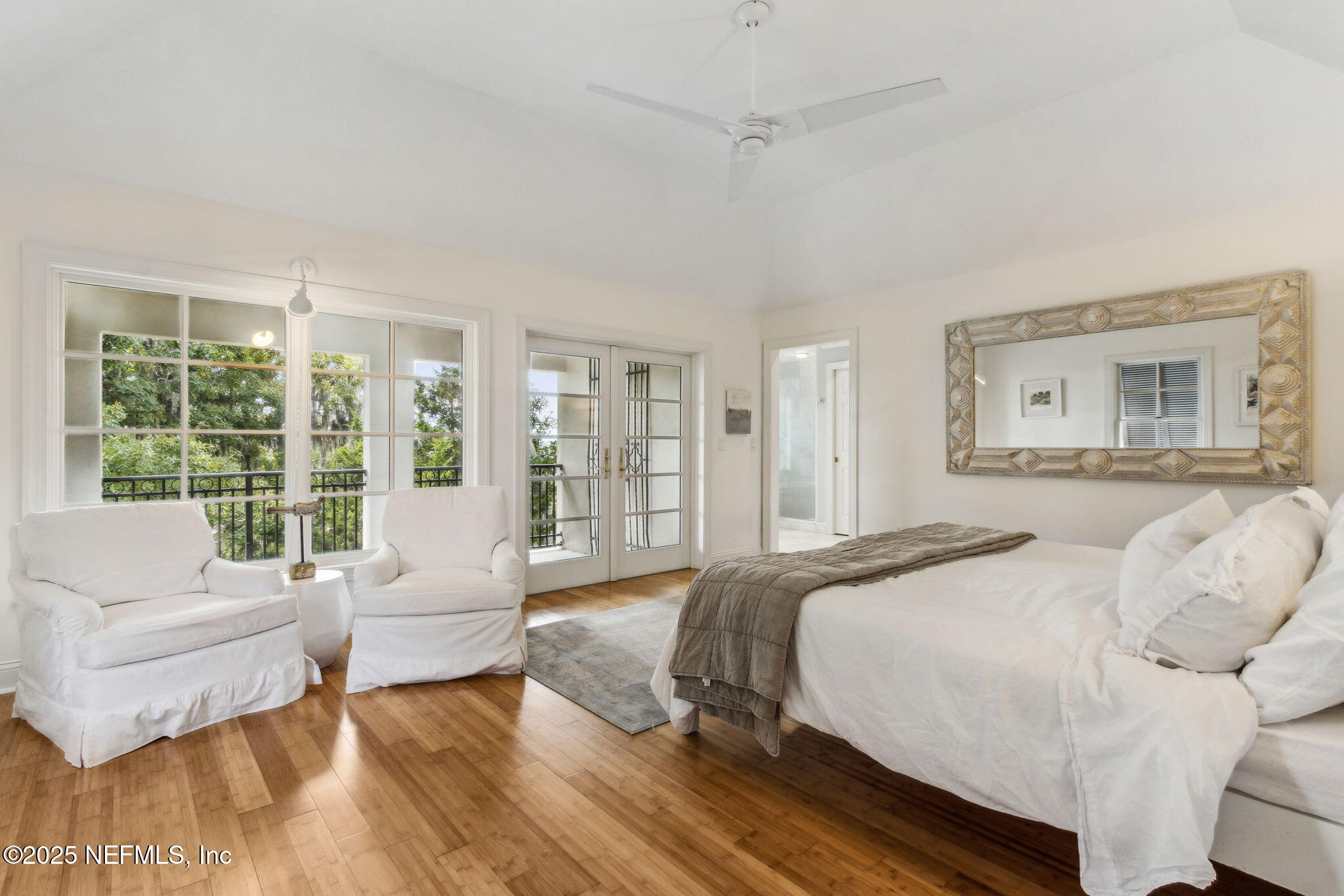 95032 Spring Tide Lane Fernandina Beach, FL 32034 - Photo 26 of 50 a spacious bedroom with a bed and a large window