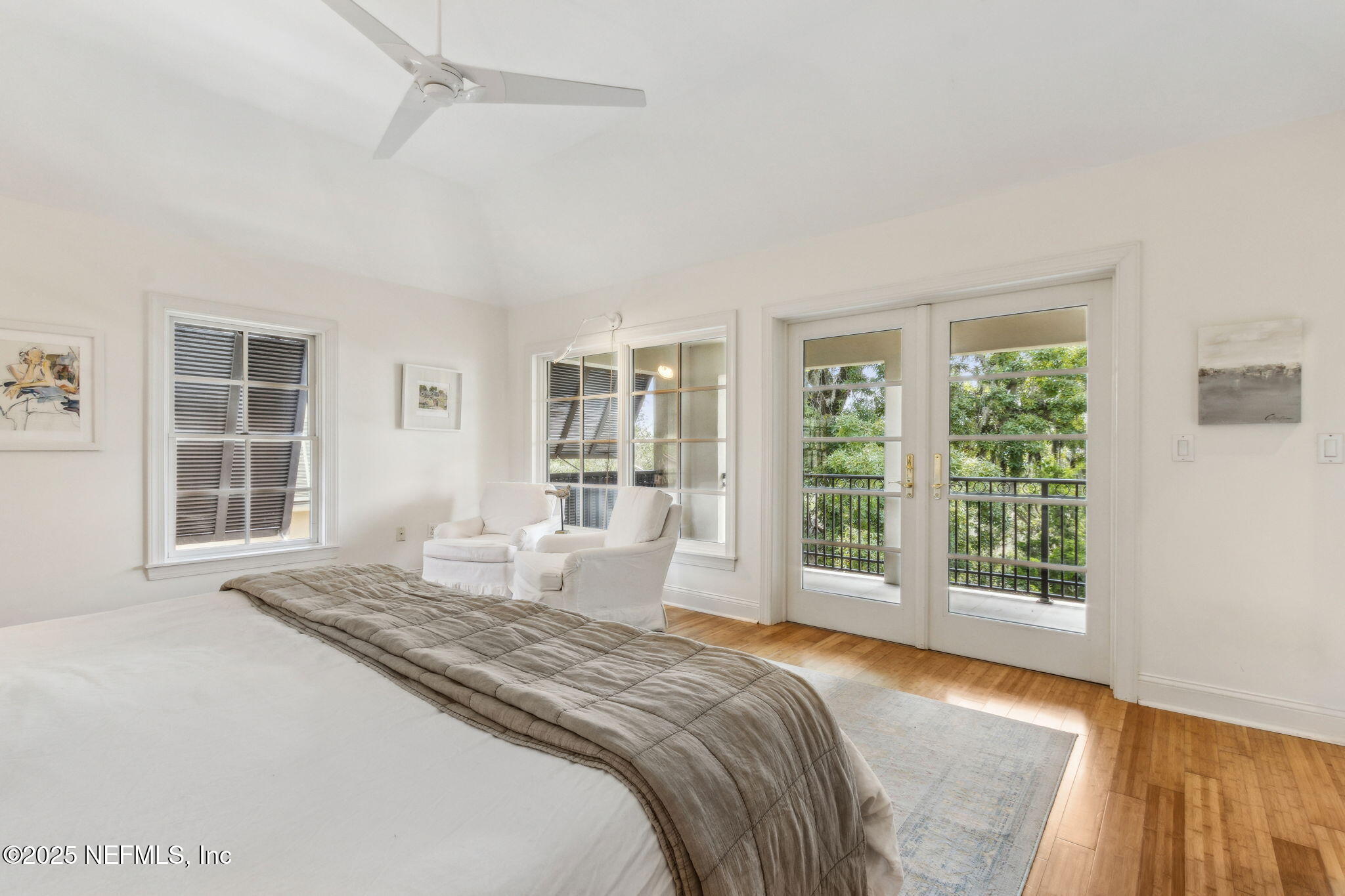 95032 Spring Tide Lane Fernandina Beach, FL 32034 - Photo 27 of 50 a spacious bedroom with a large bed and a window