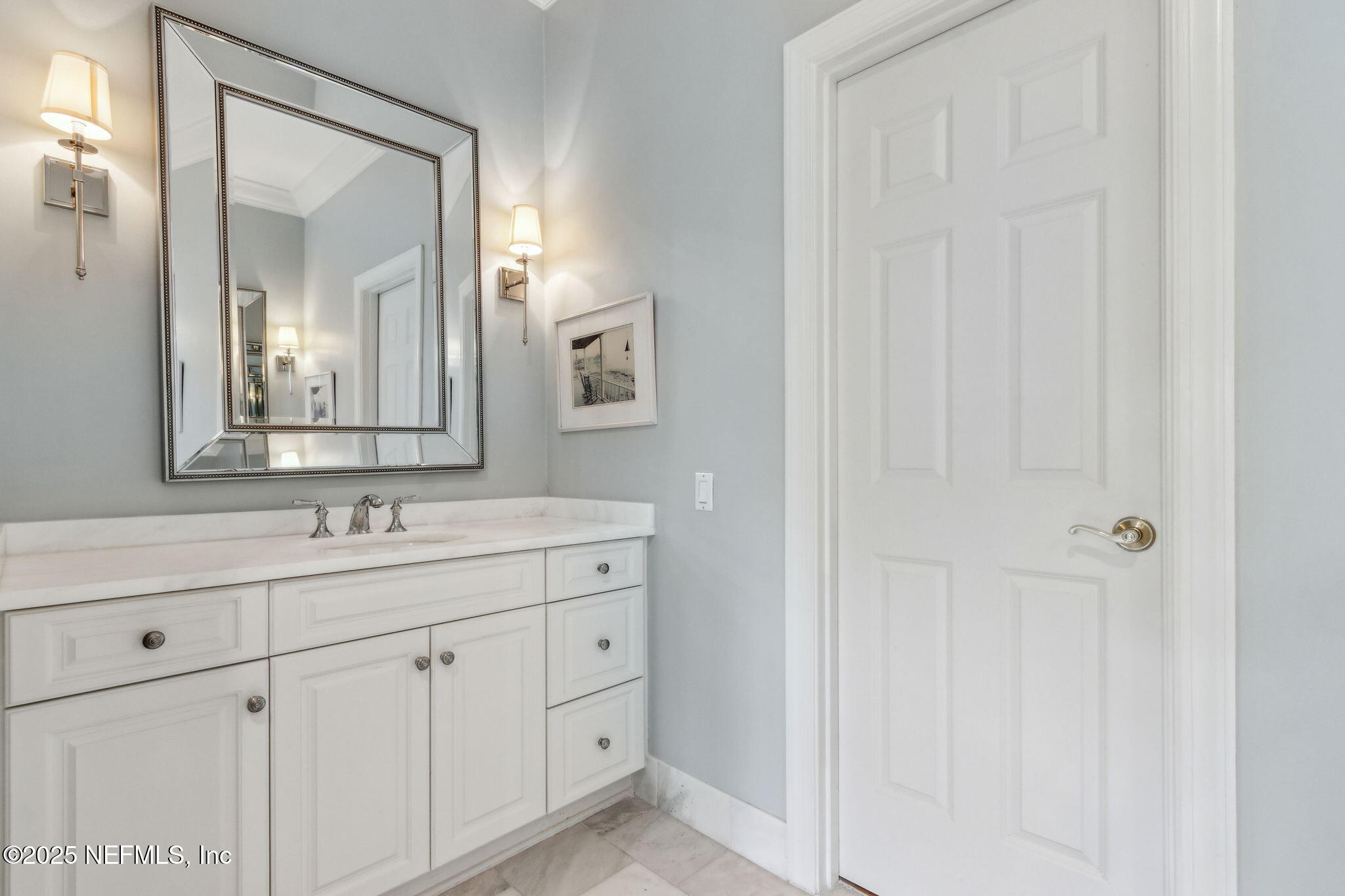 95032 Spring Tide Lane Fernandina Beach, FL 32034 - Photo 31 of 50 a bathroom with a double vanity sink and mirror