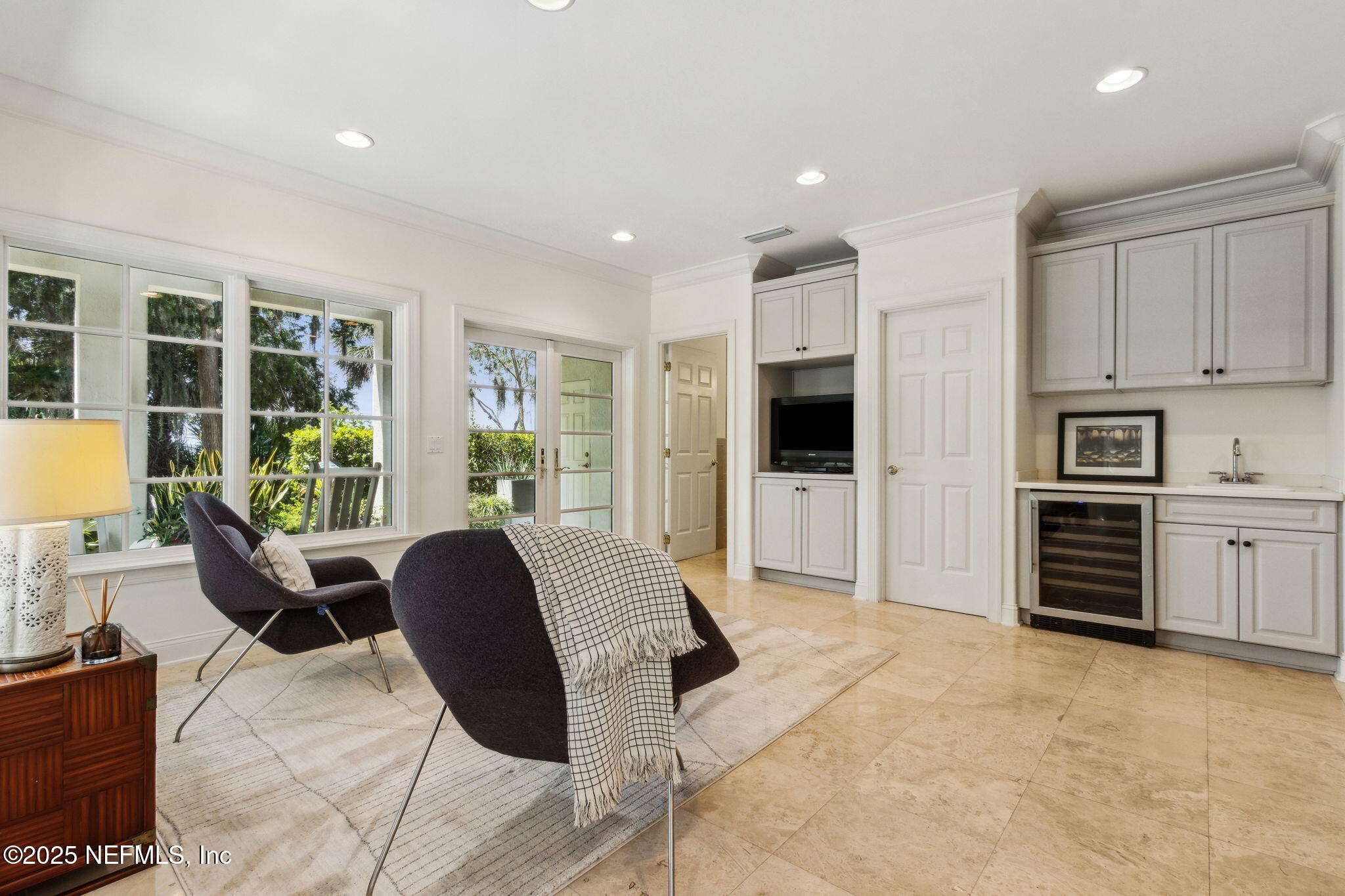 95032 Spring Tide Lane Fernandina Beach, FL 32034 - Photo 42 of 50 a living room with furniture a large window and kitchen view