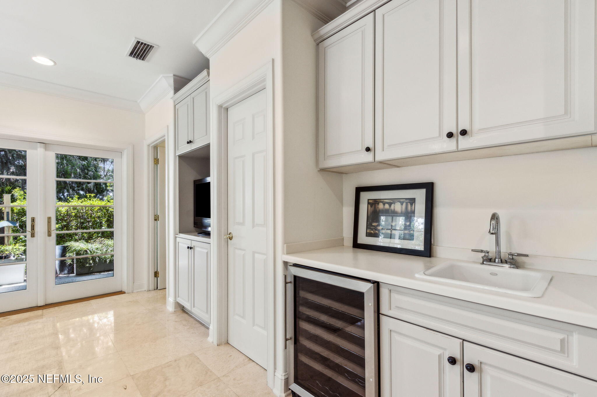 95032 Spring Tide Lane Fernandina Beach, FL 32034 - Photo 44 of 50 a kitchen with stainless steel appliances granite countertop a refrigerator and a sink