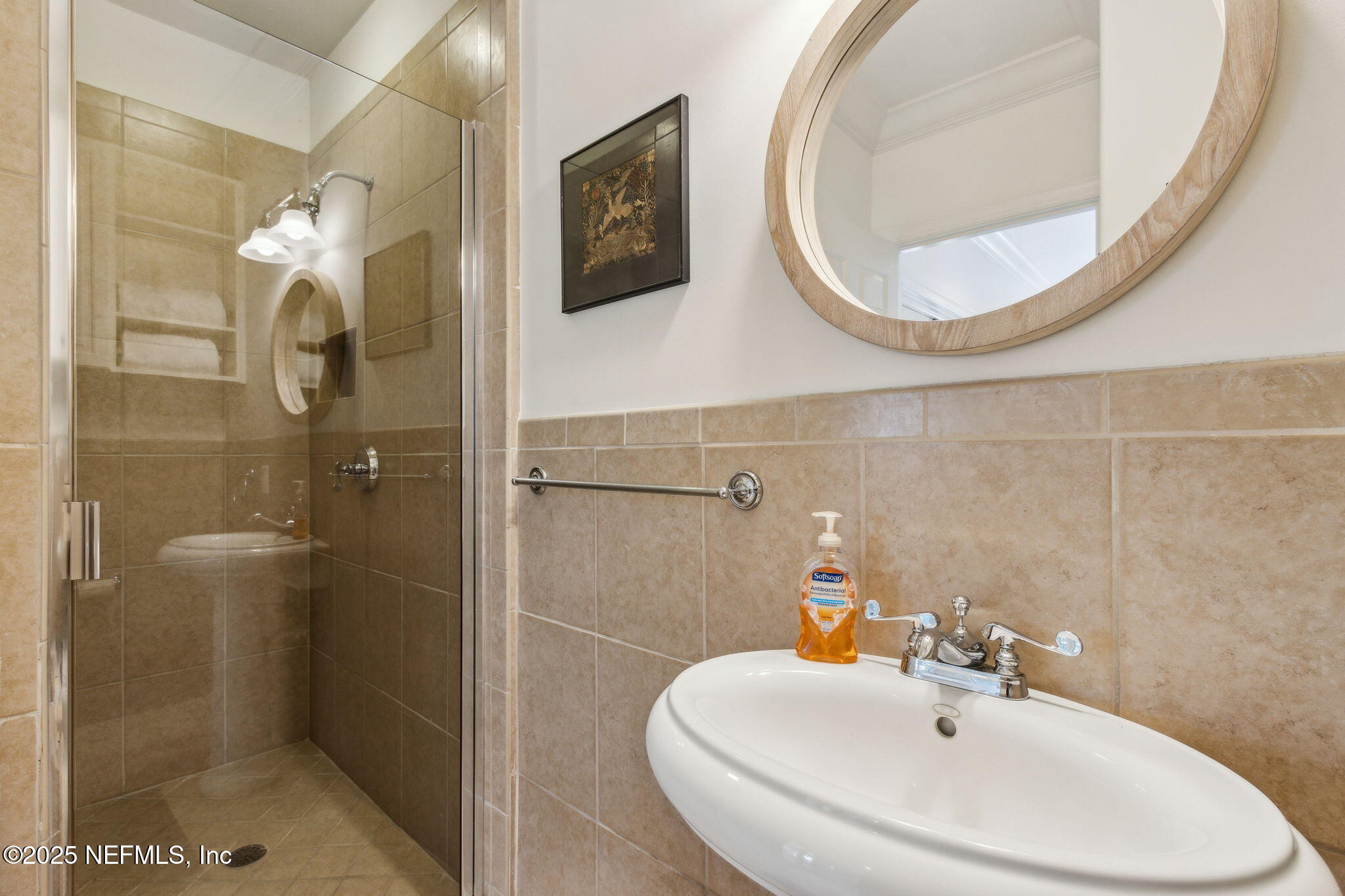 95032 Spring Tide Lane Fernandina Beach, FL 32034 - Photo 45 of 50 a bathroom with a sink and a mirror