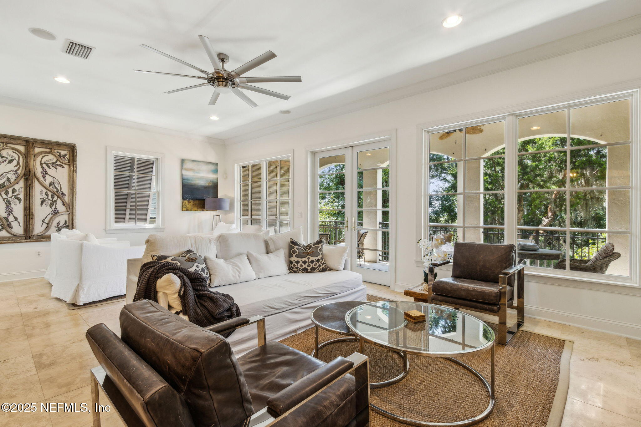 95032 Spring Tide Lane Fernandina Beach, FL 32034 - Photo 10 of 50 a living room with furniture and floor to ceiling windows