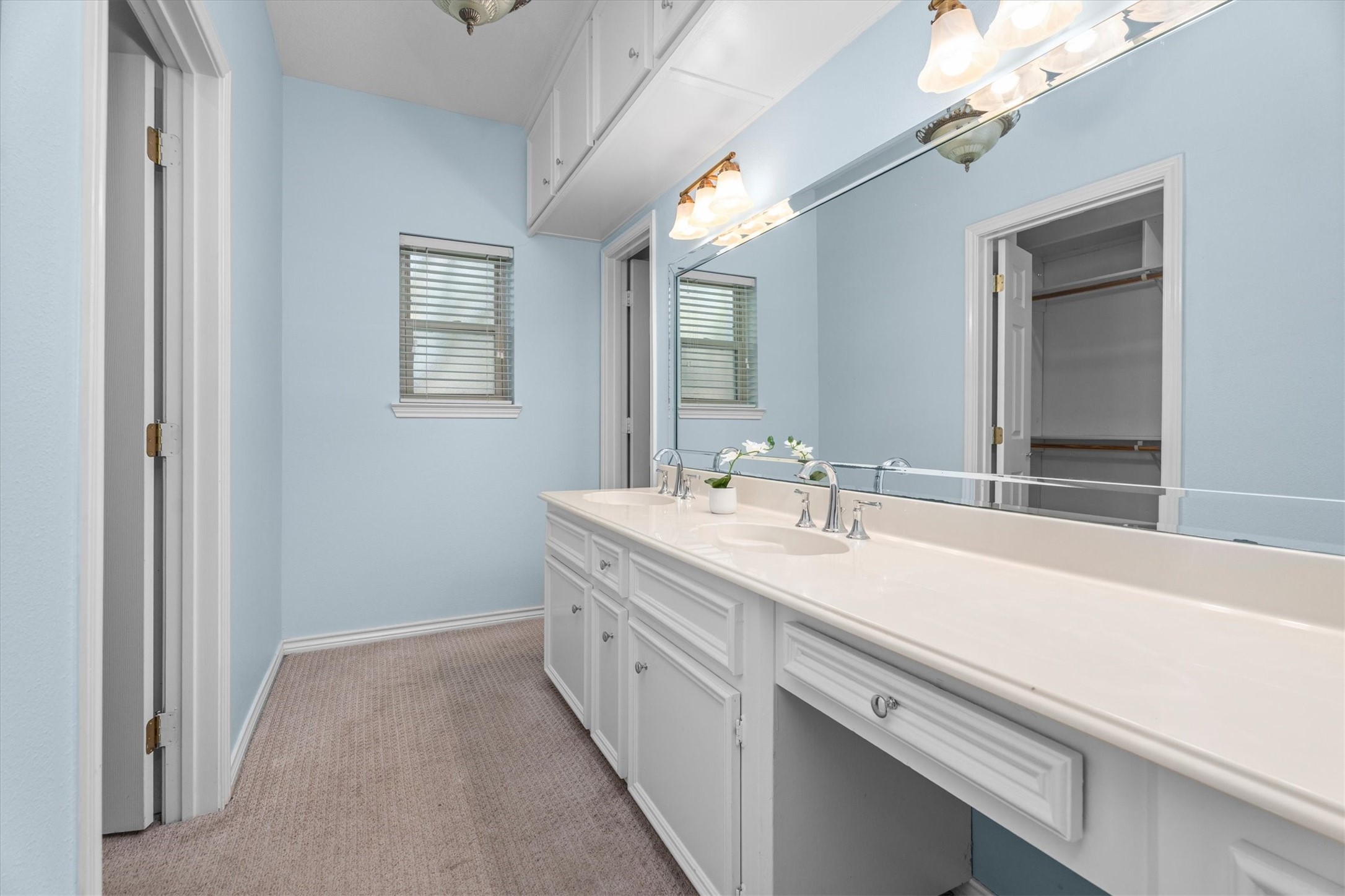 16267 Salmon Lane Spring, TX 77379 - Photo 26 of 48 The primary bath vanity features double sinks and a long vanity space, plus extensive upper and lower storage.