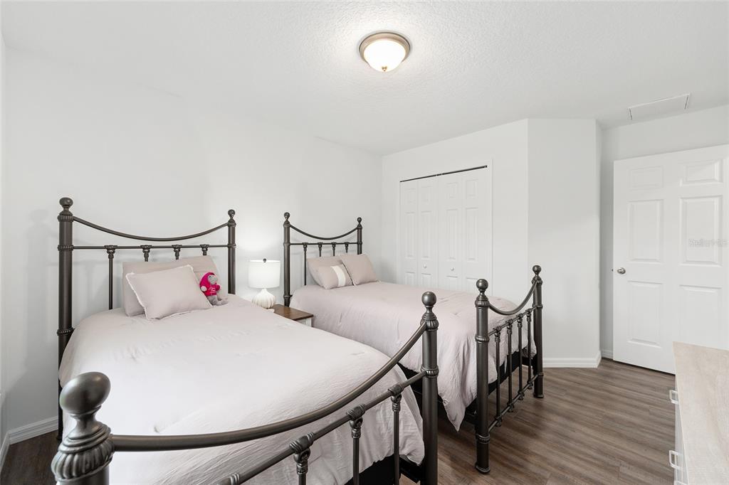 8381 North Wayside Avenue Dunnellon, FL 34433 - Photo 17 of 37 a bedroom with furniture and a chair