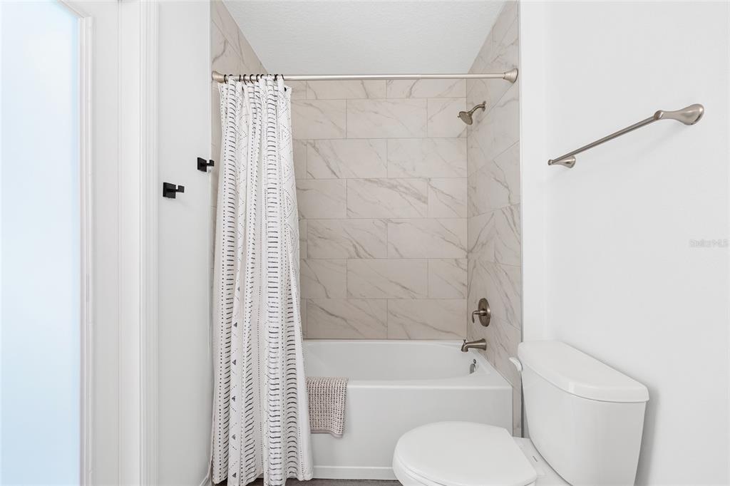 8381 North Wayside Avenue Dunnellon, FL 34433 - Photo 19 of 37 a bathroom with a toilet and a bath tub