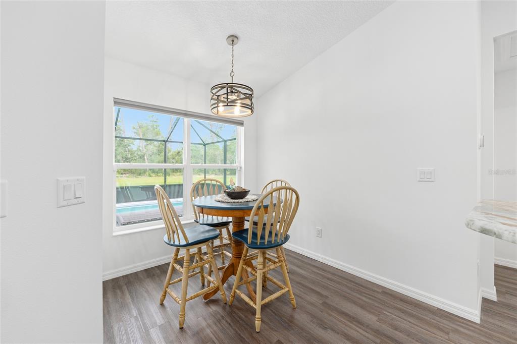 8381 North Wayside Avenue Dunnellon, FL 34433 - Photo 23 of 37 a view of a dining room with furniture window and wooden floor