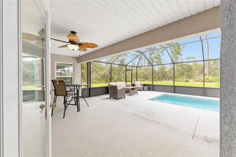 a view of a dining area with furniture window and outside view