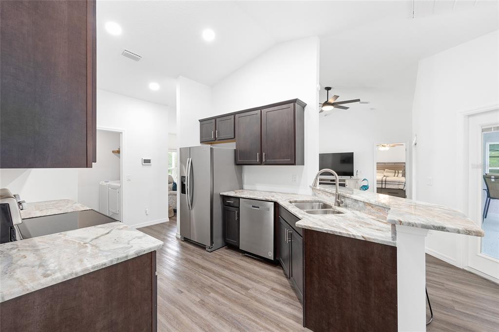 8381 North Wayside Avenue Dunnellon, FL 34433 - Photo 3 of 37 a kitchen with a sink stove and refrigerator