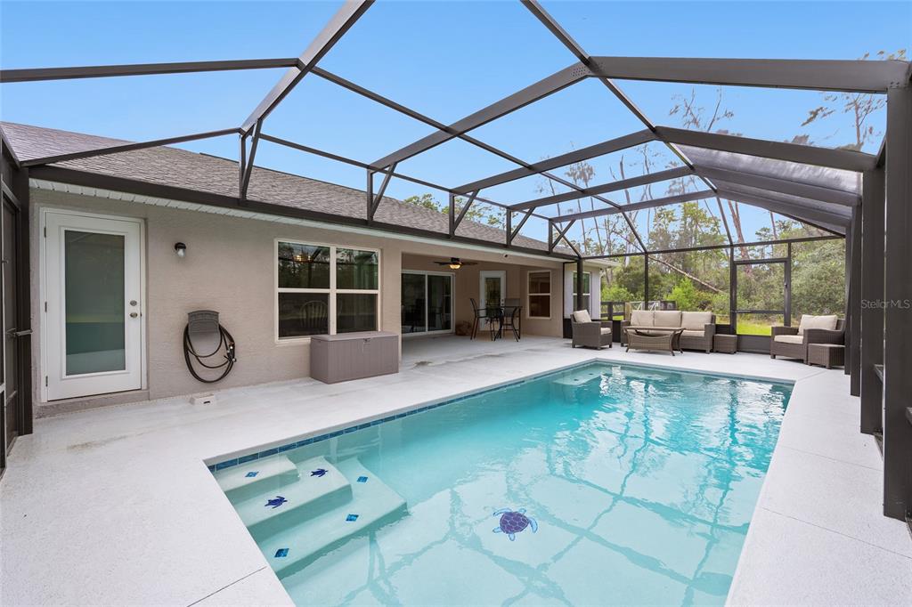 8381 North Wayside Avenue Dunnellon, FL 34433 - Photo 32 of 37 a view of a swimming pool with a patio