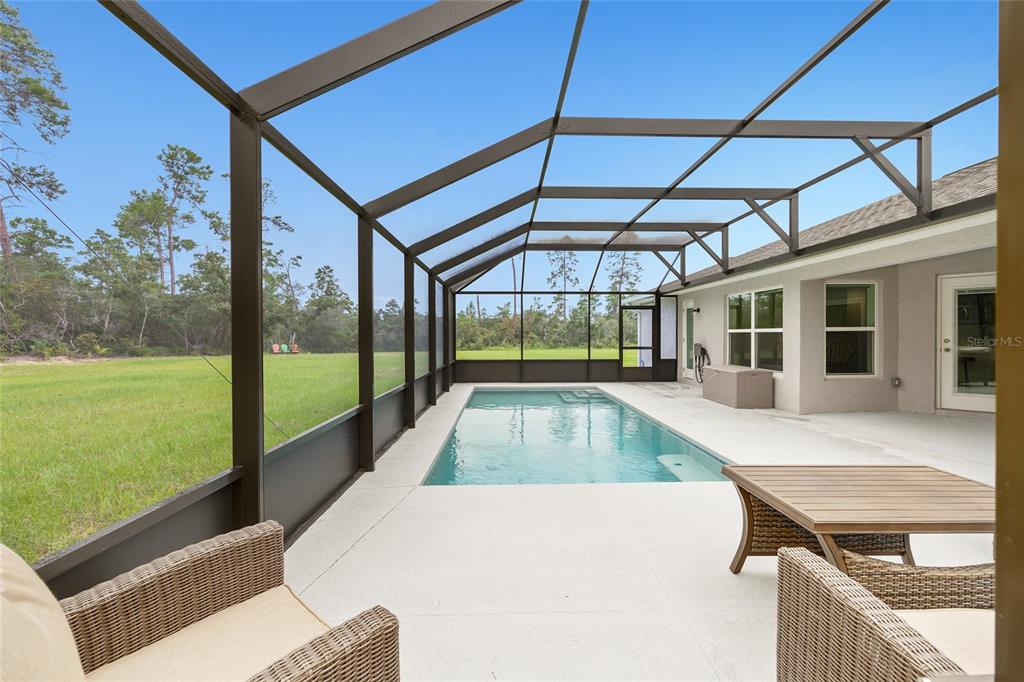 8381 North Wayside Avenue Dunnellon, FL 34433 - Photo 33 of 37 a view of swimming pool with a patio