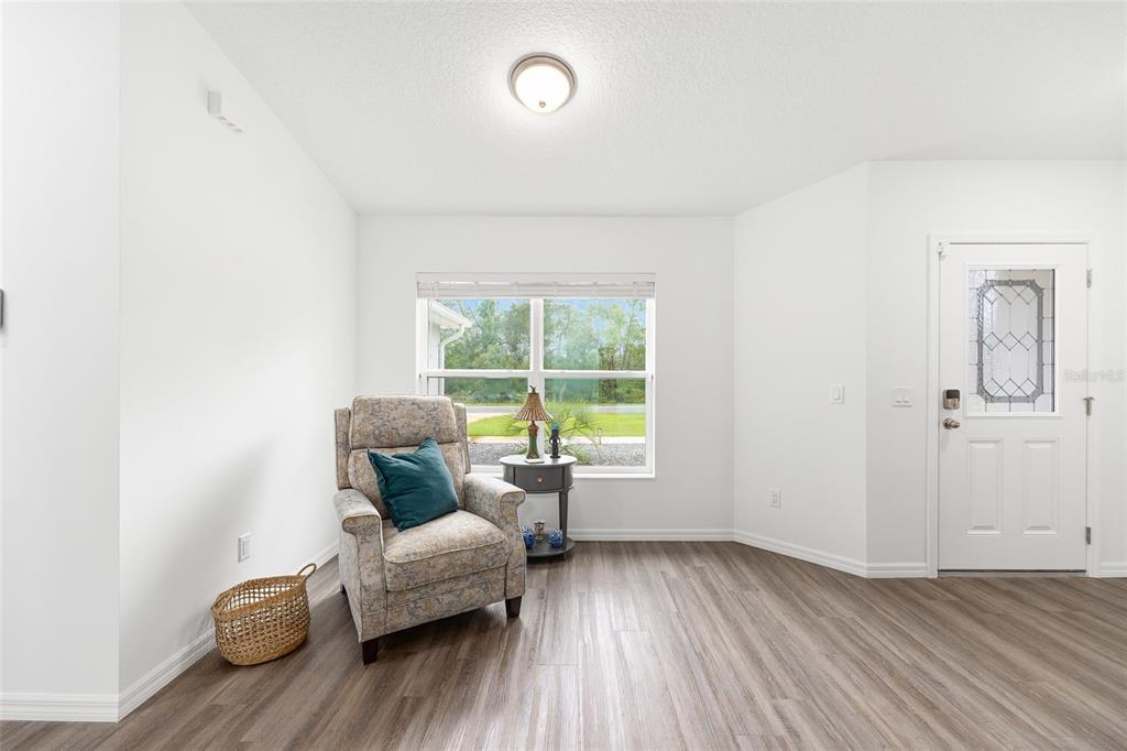 8381 North Wayside Avenue Dunnellon, FL 34433 - Photo 10 of 37 a living room with furniture and a window