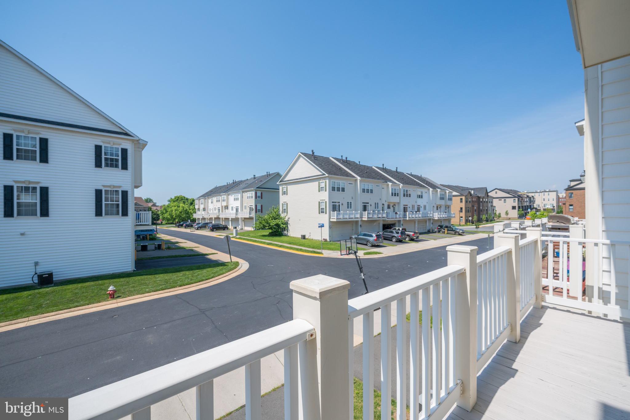 42429 Redstone Terrace Brambleton, VA 20148 - Photo 11 of 35 a balcony with furniture and garden
