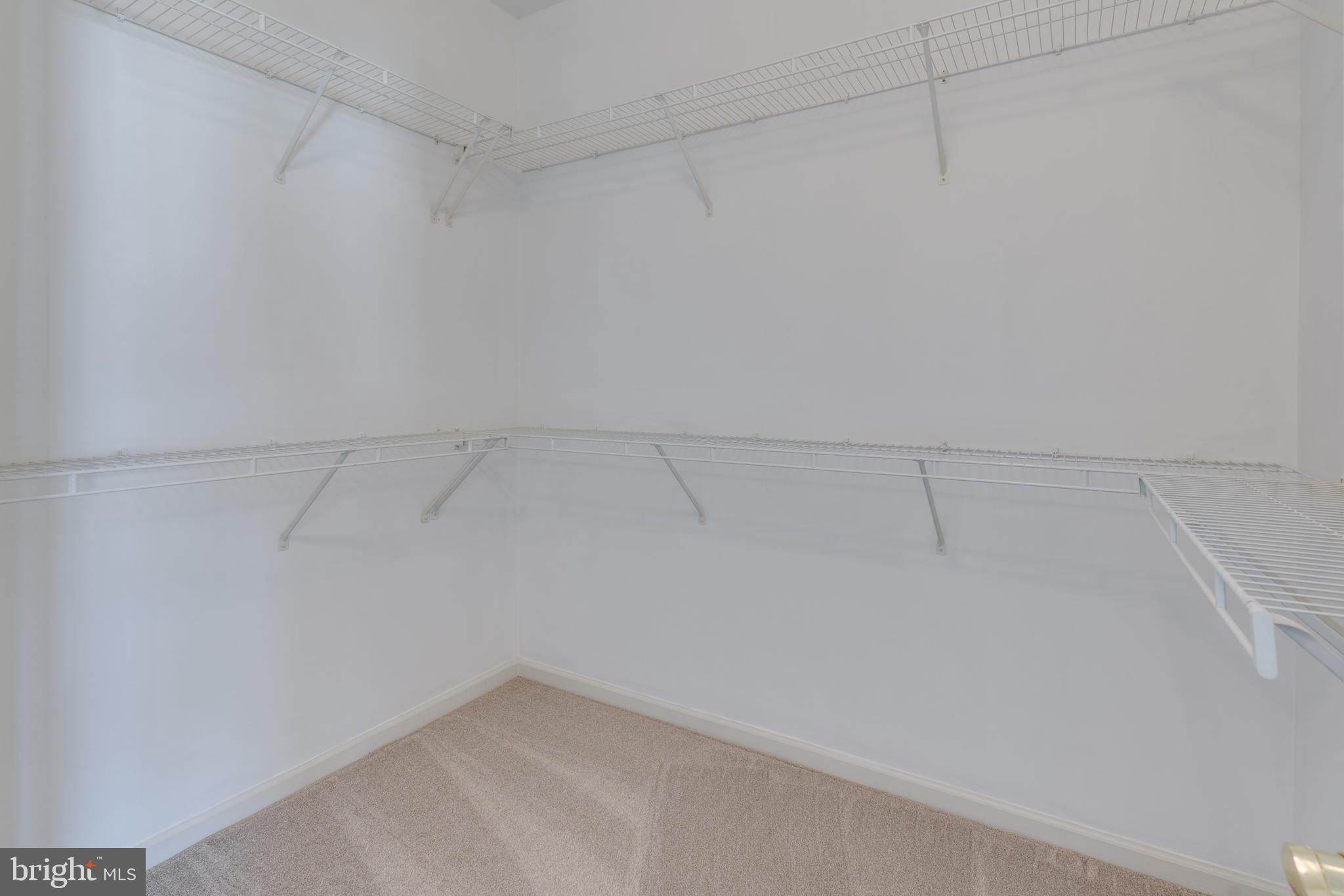 42429 Redstone Terrace Brambleton, VA 20148 - Photo 24 of 35 a view of a room with racks on the wall