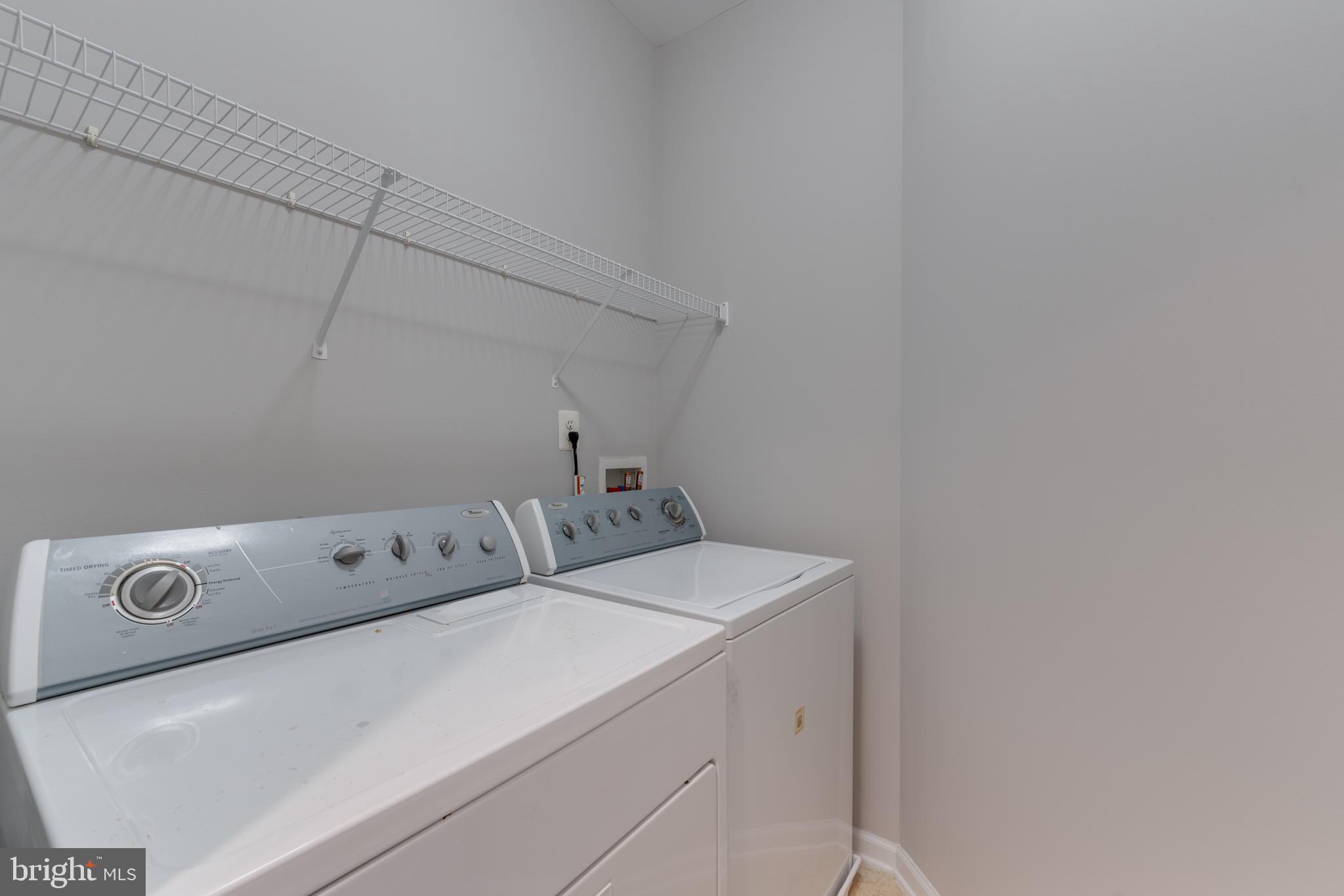 42429 Redstone Terrace Brambleton, VA 20148 - Photo 25 of 35 a utility room with dryer and washer