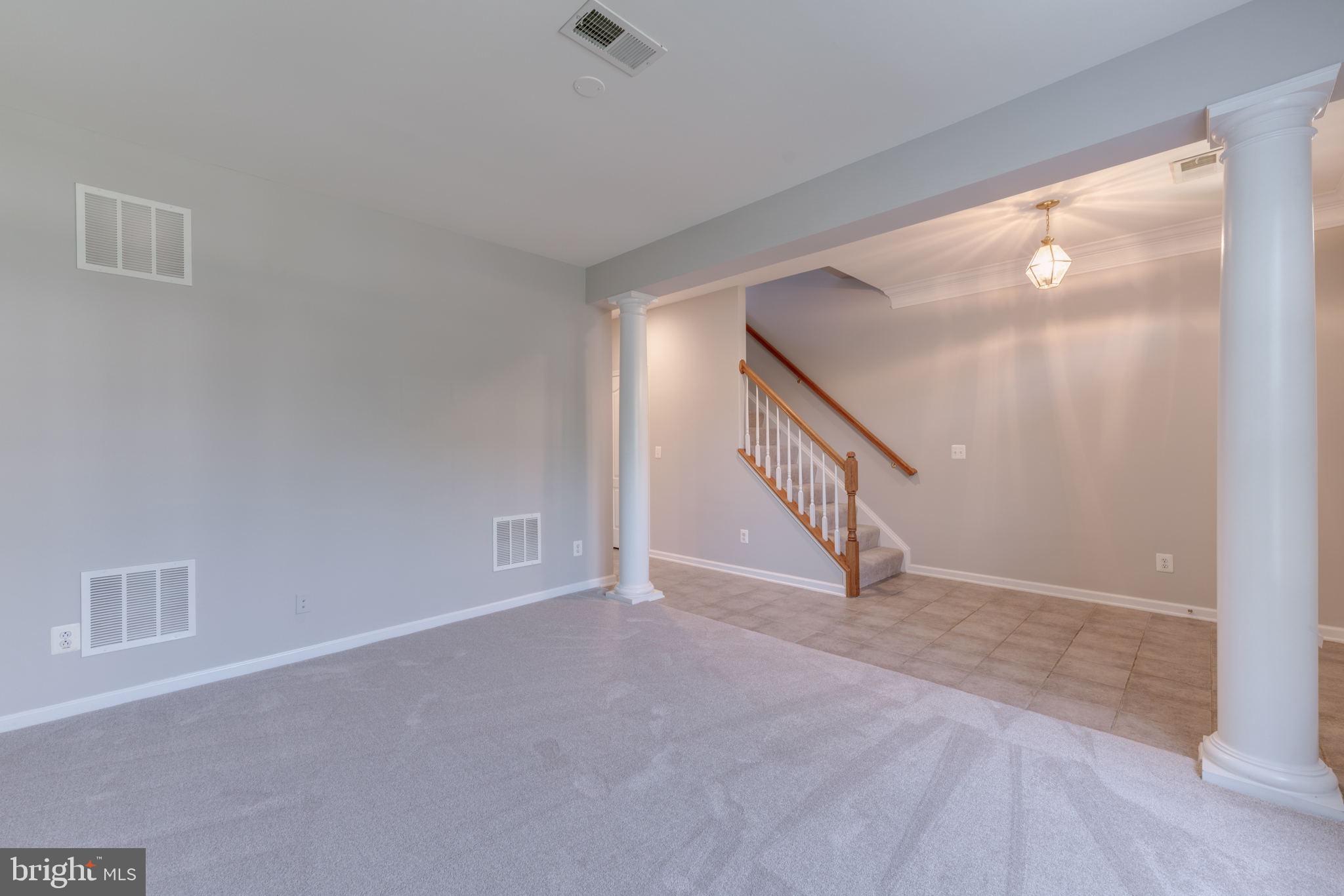 42429 Redstone Terrace Brambleton, VA 20148 - Photo 7 of 35 a view of an entryway with staircase