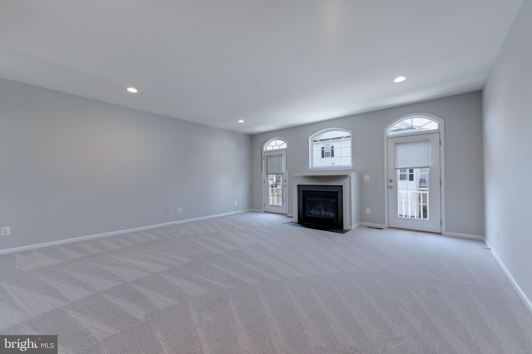 42429 Redstone Terrace Brambleton, VA 20148 - Photo 10 of 35 a view of empty room with a fireplace