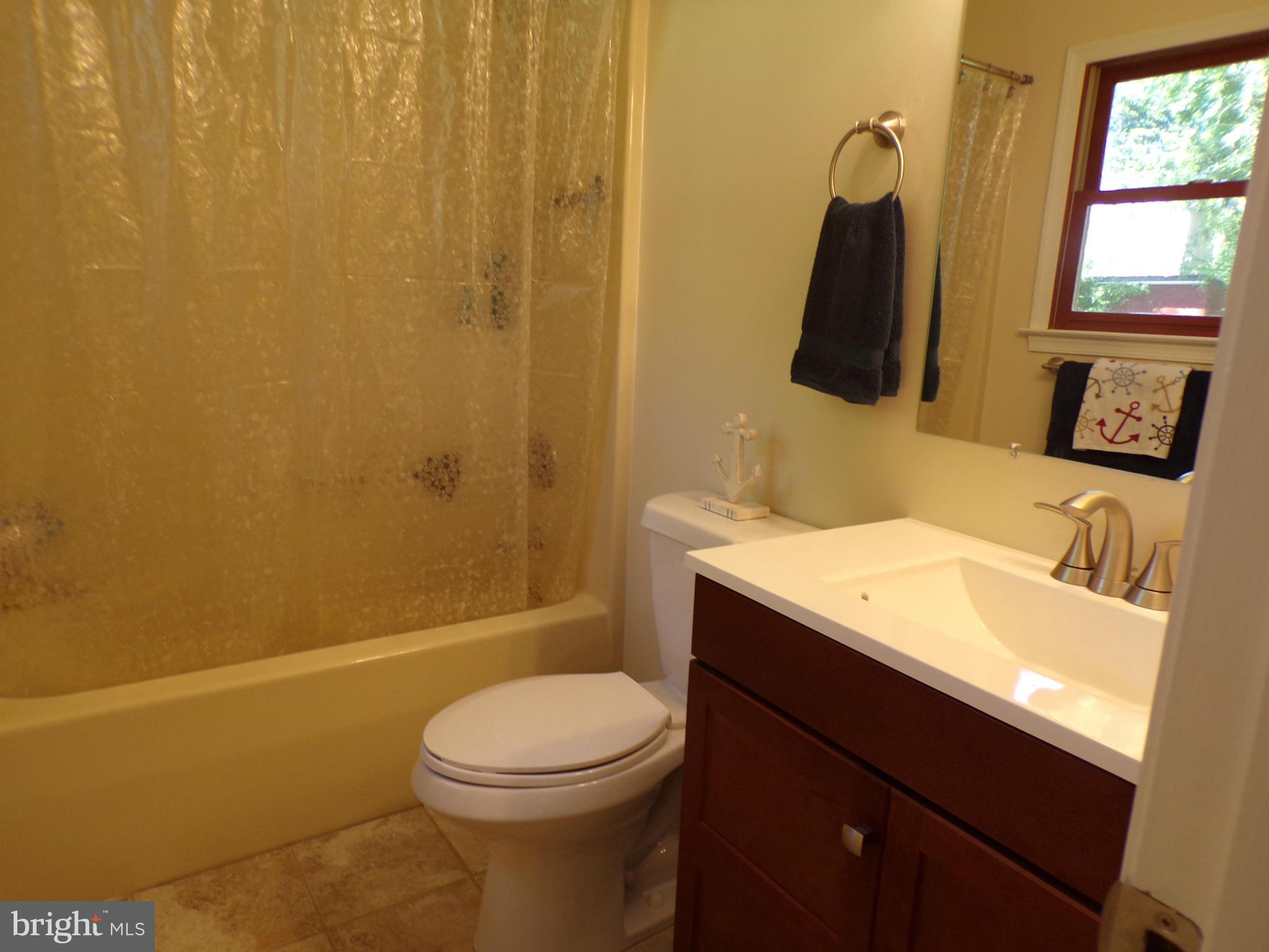 520 Brentwood Road Edgewater, MD 21037 - Photo 11 of 18 a bathroom with a sink a toilet and tub