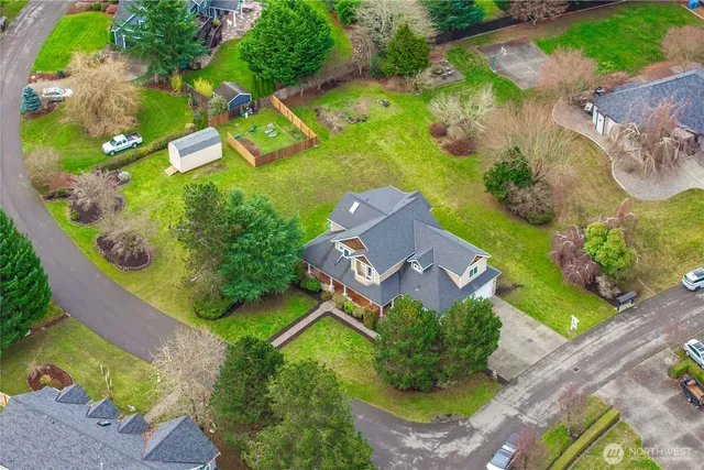an aerial view of a house with a garden